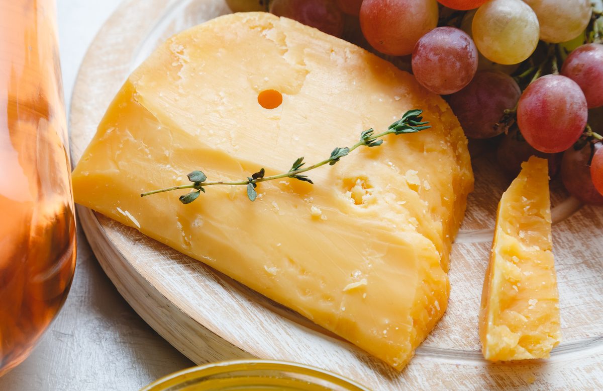 Cheese wheels with grapes