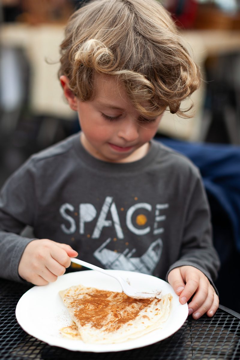 Child eating crepe